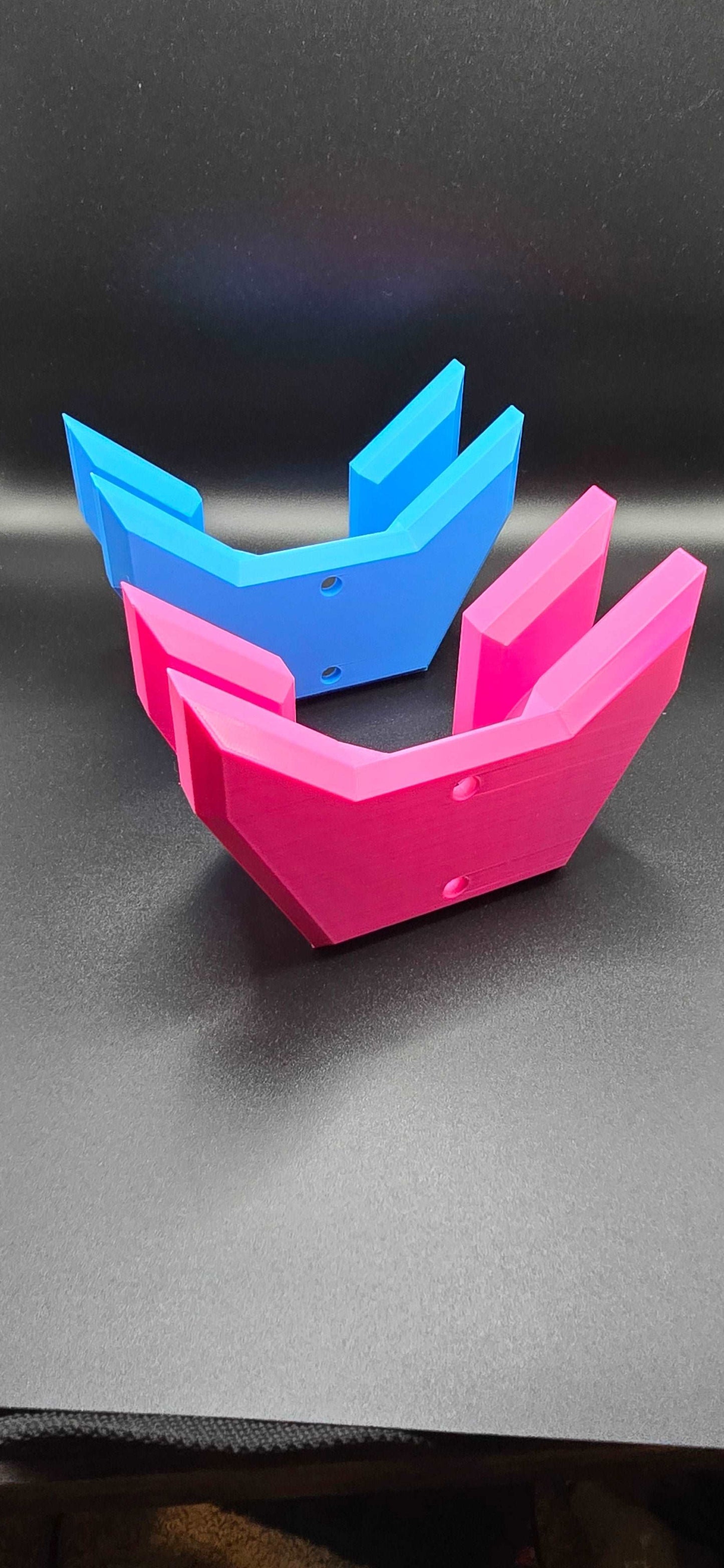 Colorful 3D printed pickleball paddle wall mount from Tarbon Designs store, featuring innovative geometric design in vibrant blue and pink shades.