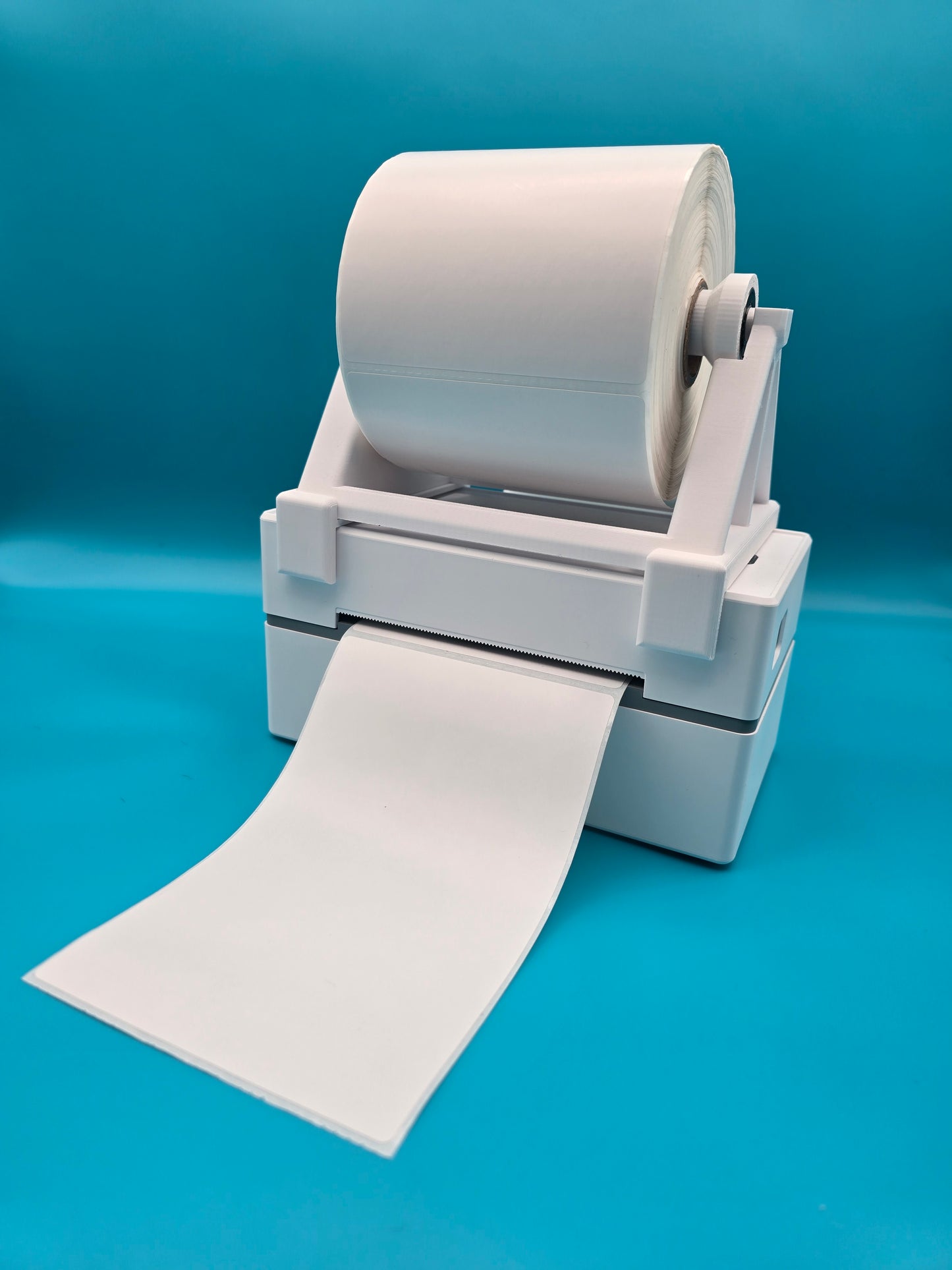 Sleek desktop label printer stand with white thermal paper roll for efficient shipping label printing