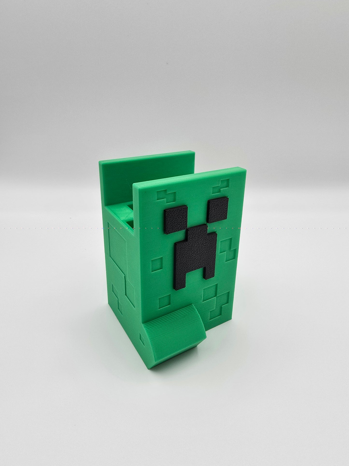 Iconic Minecraft Creeper Nintendo Switch Controller and Joy-con Holder, featuring a detailed 3D printed design that immerses gamers in the beloved blocky world.