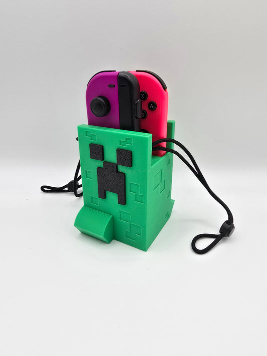 3D printed Minecraft Creeper Nintendo Switch controller and Joy-con holder in vibrant pink and green colors