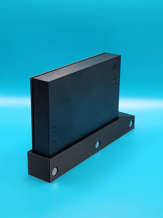 Sleek modular Xbox organizer system with magnetic HDD/SSD holder in a bold black design.