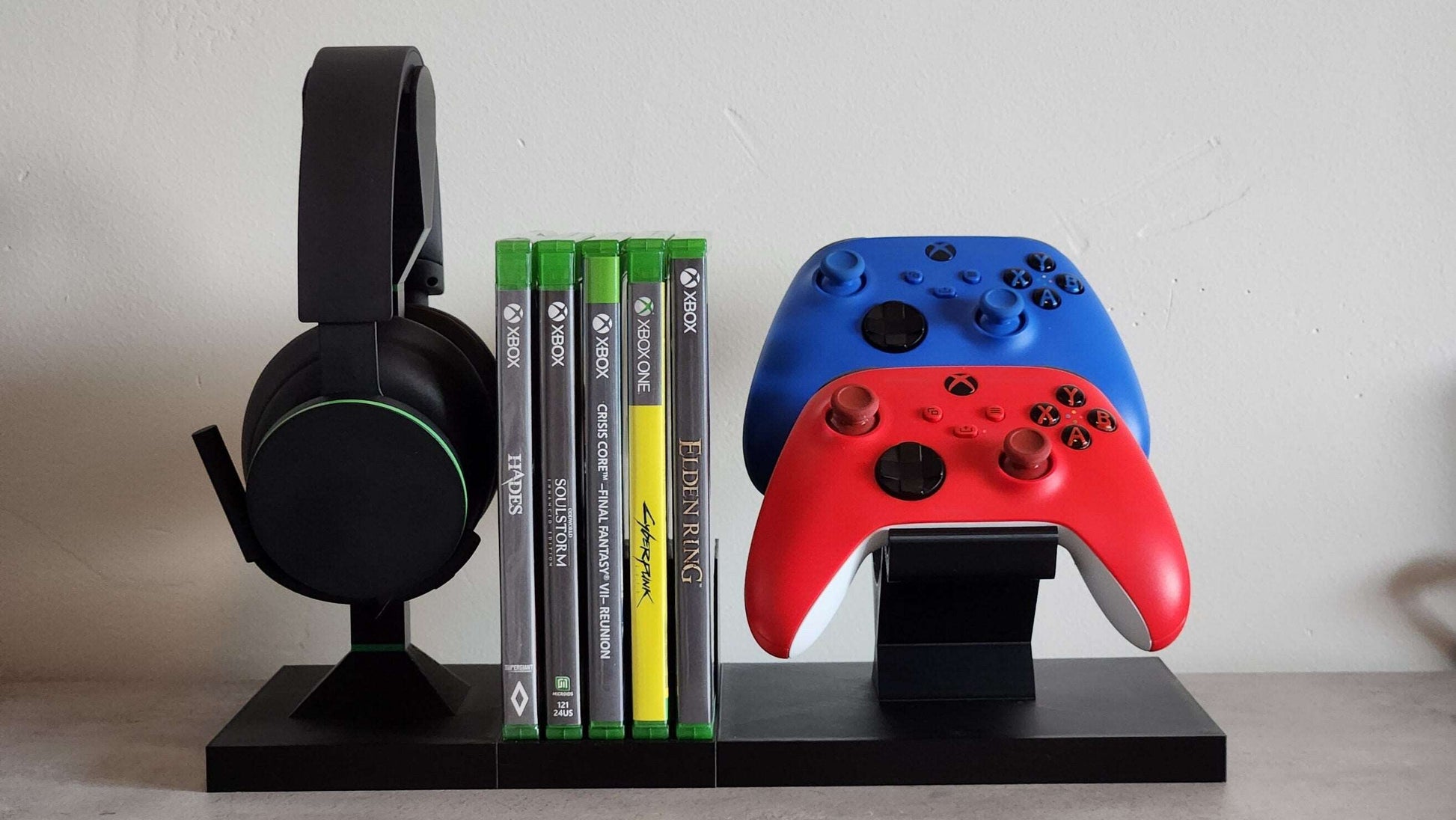 Modular Xbox game storage system with colorful controllers and headset, designed to organize and display gaming accessories.